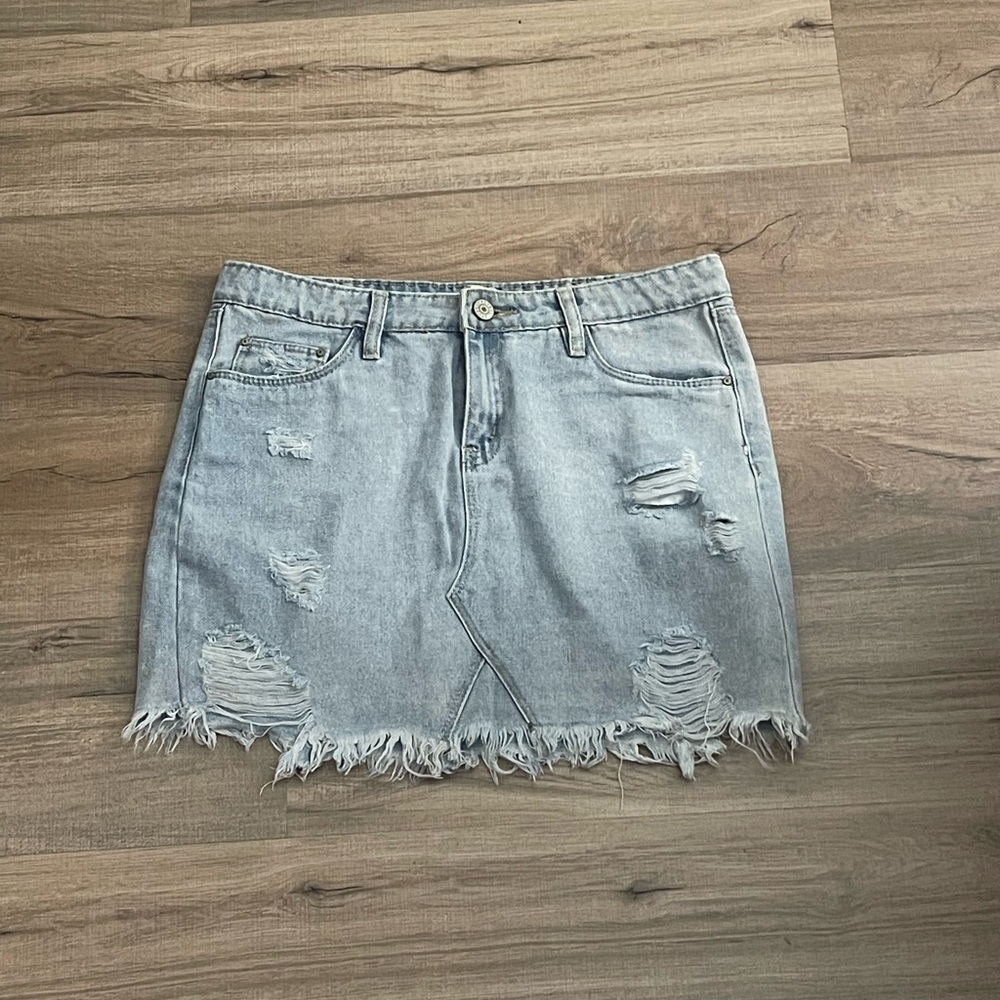 Distressed denim mini skirt